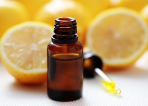 bottle-of-lemon-essential-oil-with-lemon-halves