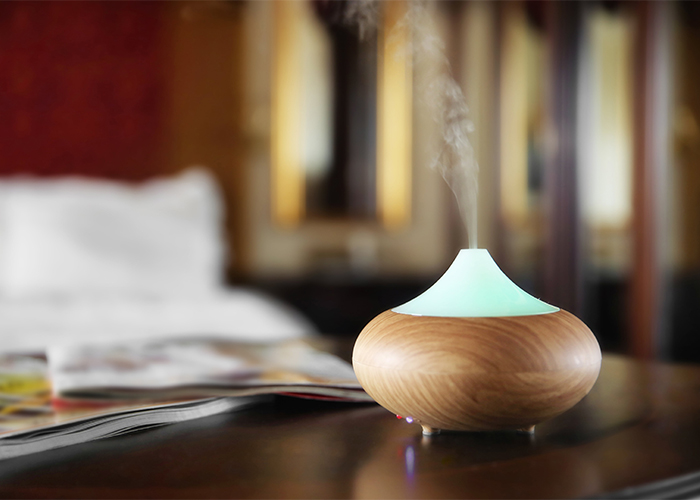 A wooden diffuser filled with citrus essential oils with natural sedative properties. 