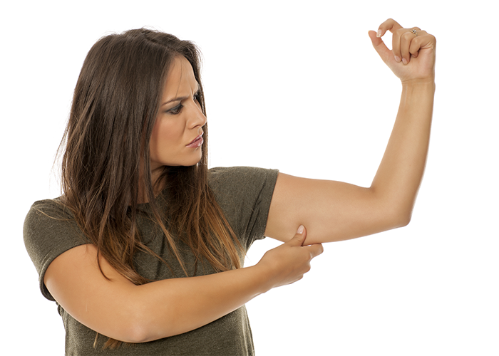 Woman pinching her flabby arms