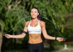 Woman doing cardio skipping exercises