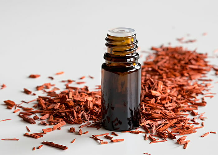 Bottle of homemade anti-inflammatory rose and sandalwood essential oil blend