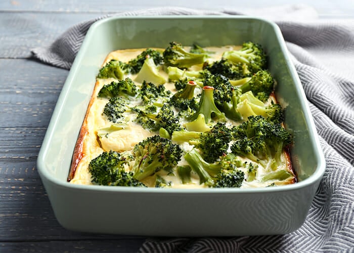 Paleo chicken and broccoli casserole in a white baking dish