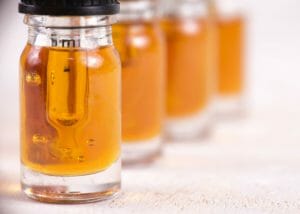 cbd cannabis oil in clear vials with droppers