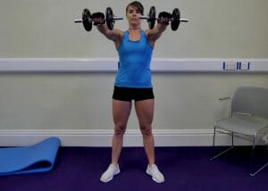 woman doing up and outs dumbbell exercises