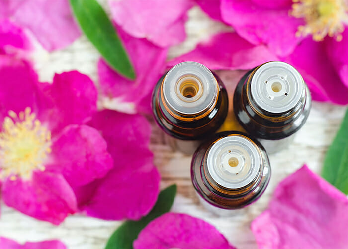 Top-down view of three different kinds of essential oil bottles