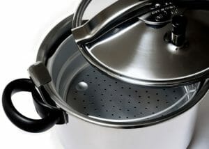 Aluminum pressure cooker with lid open