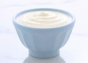 A light blue bowl filled with a large serving of DIY yogurt