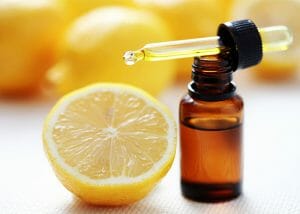 A bottle of lemon essential oil with a dropper