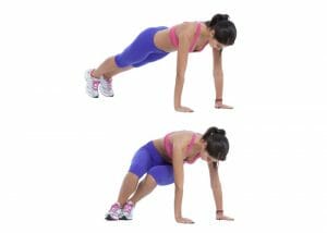 woman on the floor doing ski abs lower ab exercises