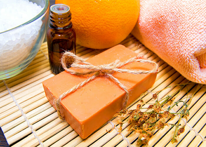 A homemade orange essential oil disinfecting soap bar