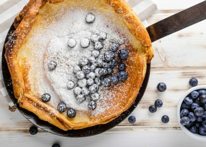 oven bake sorghum flour pancakes topped with sugar dusting and blueberries