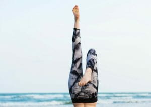 shot of a woman's feet up in the air with stylish fitness pants