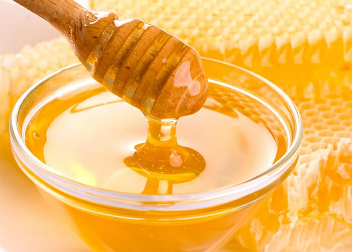 Bowl of honey for use as a Paleo sweetener