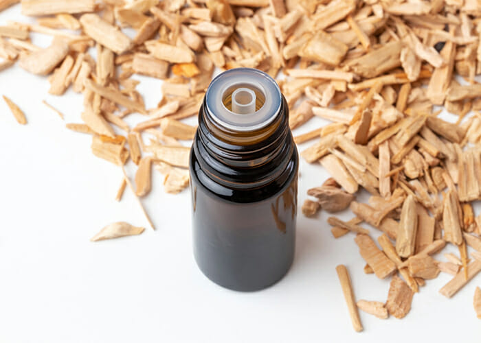 A bottle of cedarwood essential oil