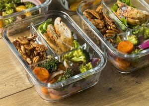 Keto meal prep containers filled with keto-approved foods