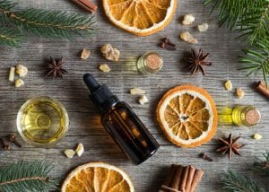 Flat lay featuring orange and anise essential oil blend