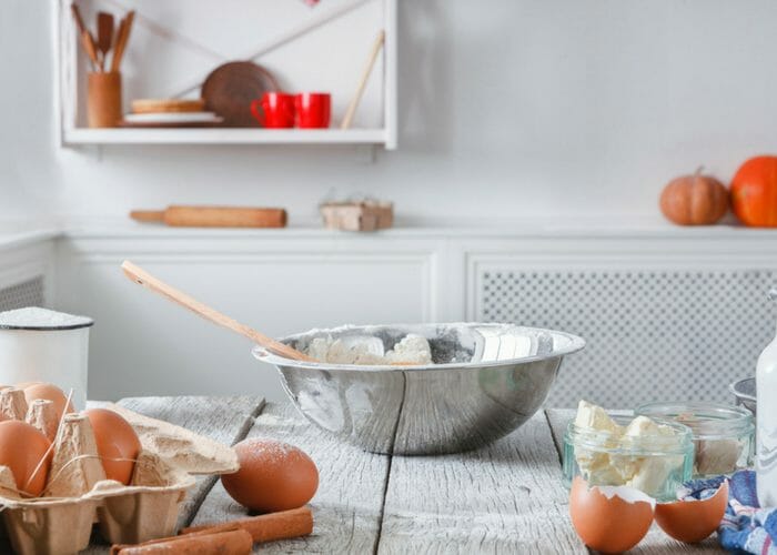 metal bowl on a kitchen counter with brown eggs